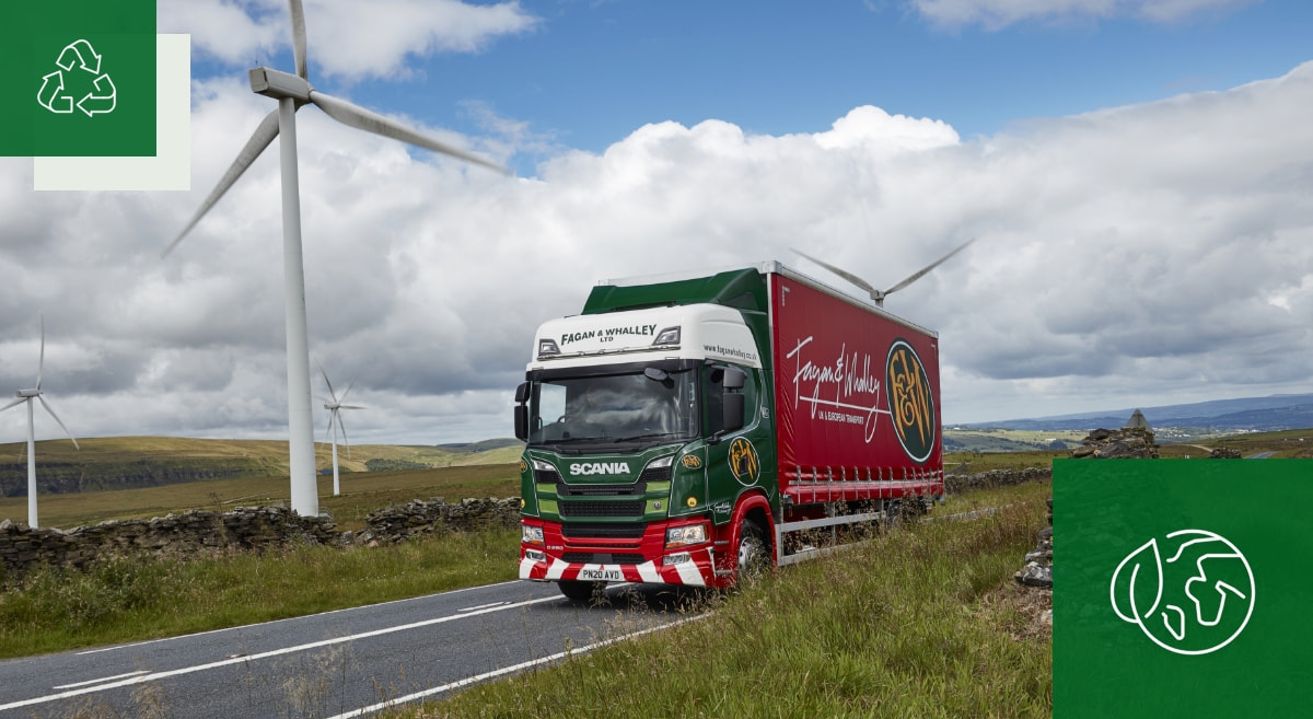 Lorry on a road with wind turbines|fagan & whalley vehicle on a road|warehouse with fagan & whalley vehicle and forklfits|fagan & whalley vehciles in warehouse