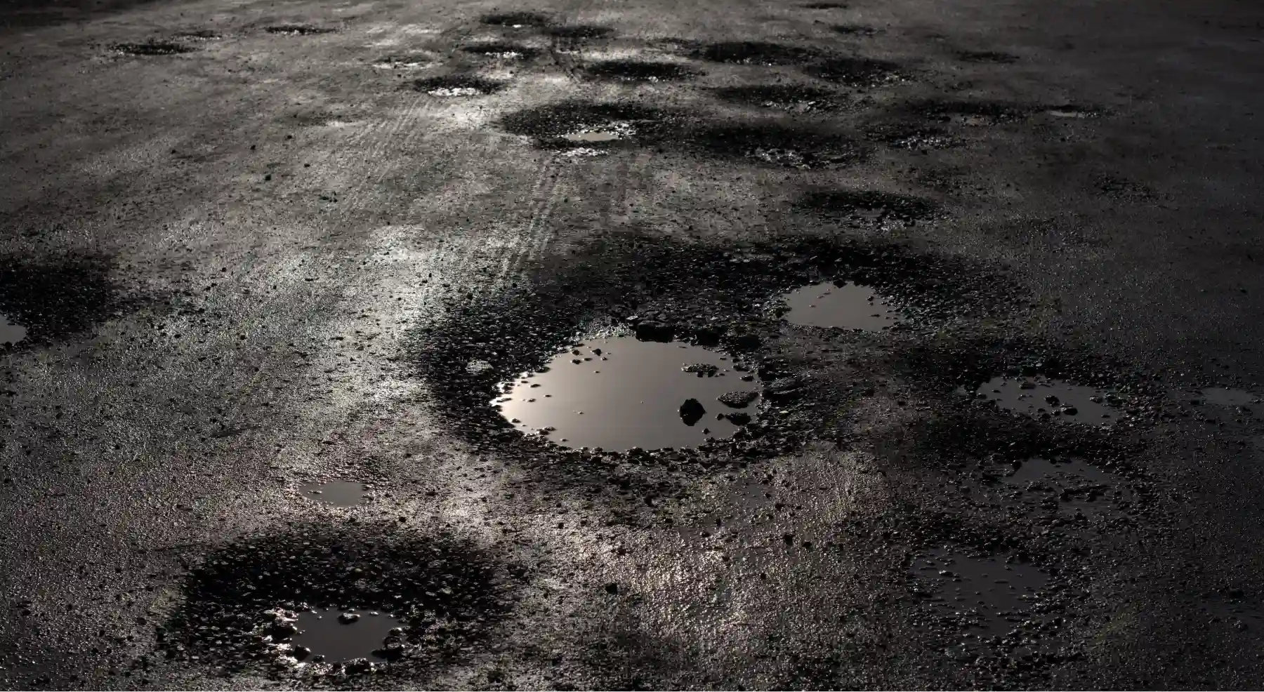 Potholes in road